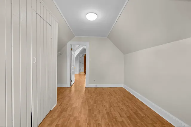 a view of hallway with wooden floor
