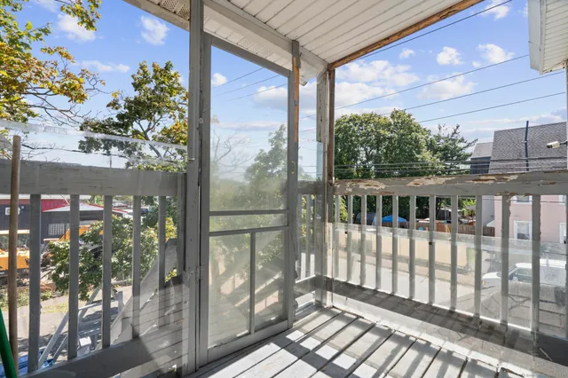 a balcony view with a garden