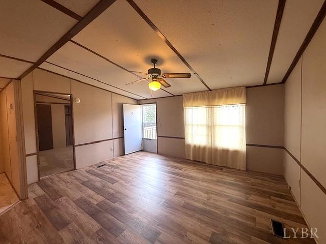 2041 Eureka Mill Road Keysville, VA 23947 - Photo 12 of 37 a view of empty room with wooden floor and fan