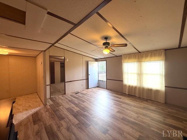 2041 Eureka Mill Road Keysville, VA 23947 - Photo 13 of 37 a view of empty room with wooden floor and fan