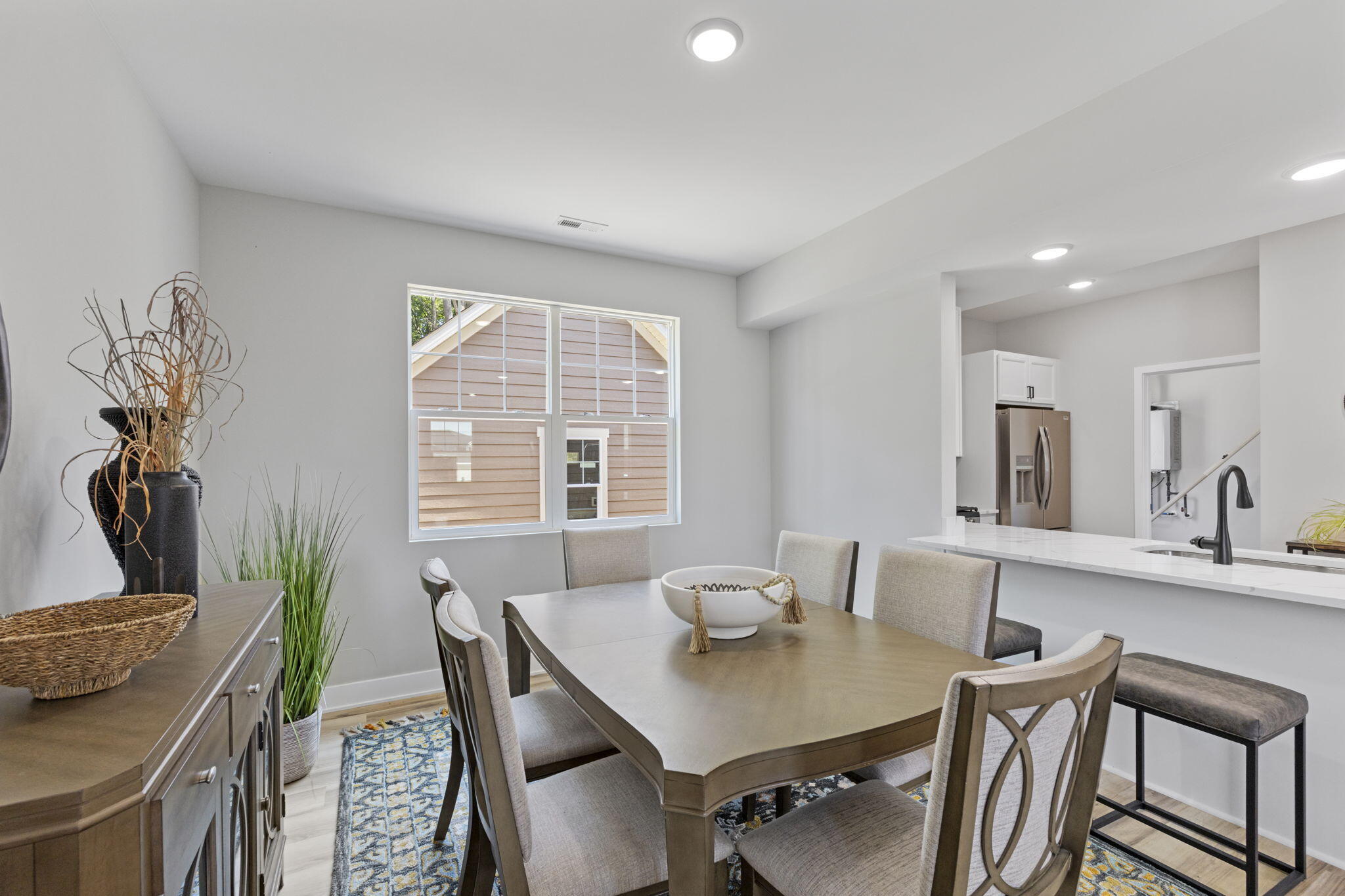 1183 Harbor Way Chesterton, IN 46304 - Photo 8 of 20 a view of a dining room with furniture and a potted plant