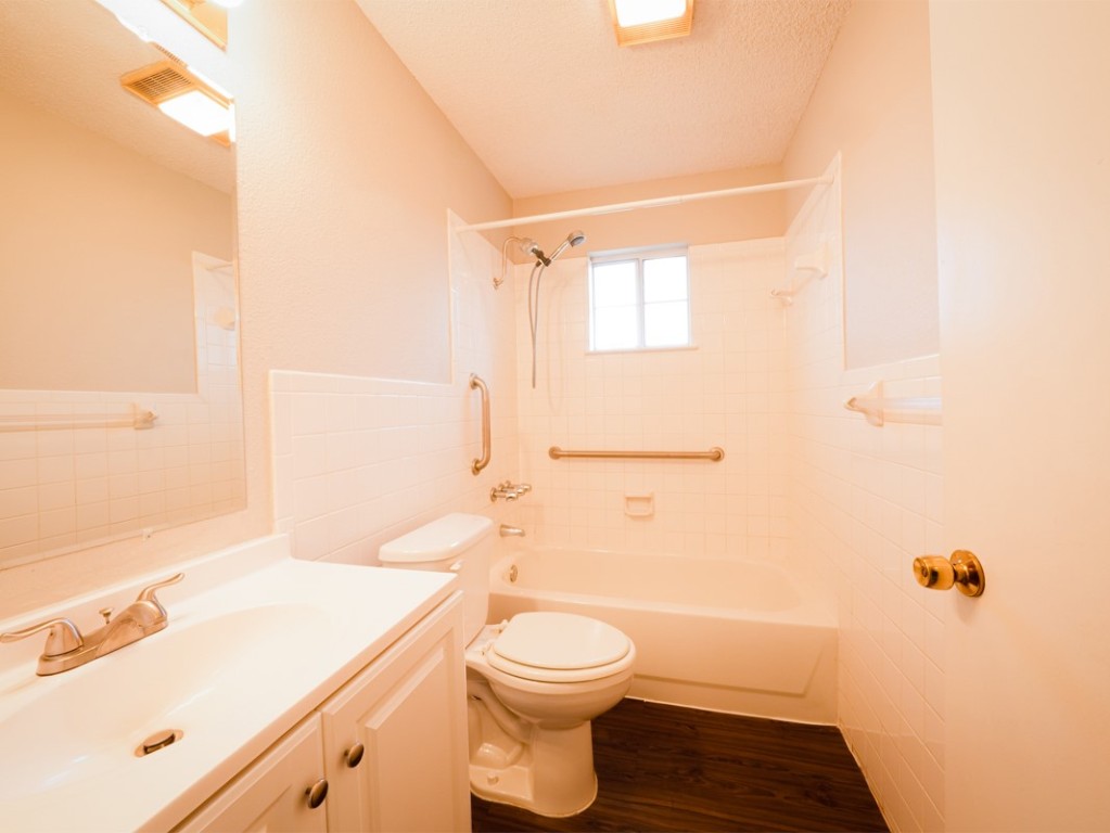 7312 Providence Avenue Austin, TX 78752 - Photo 11 of 22 a bathroom with a sink a toilet and shower