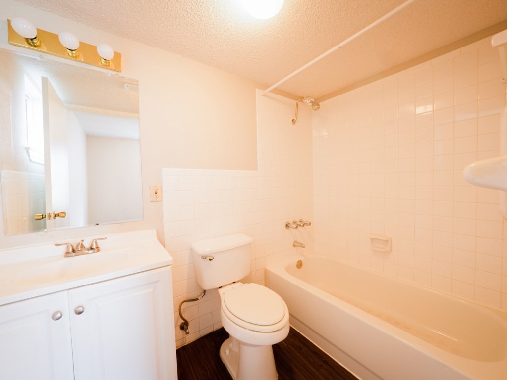 7312 Providence Avenue Austin, TX 78752 - Photo 12 of 22 a bathroom with a sink a toilet and shower