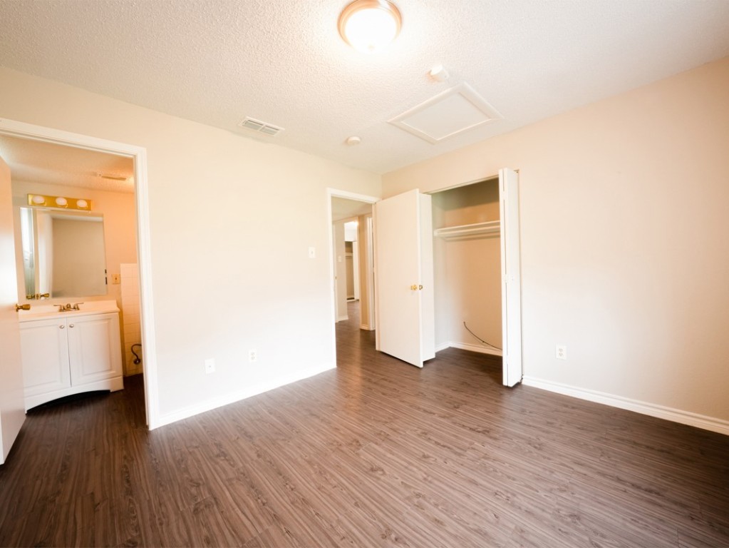 7312 Providence Avenue Austin, TX 78752 - Photo 14 of 22 a view of an empty room with wooden floor