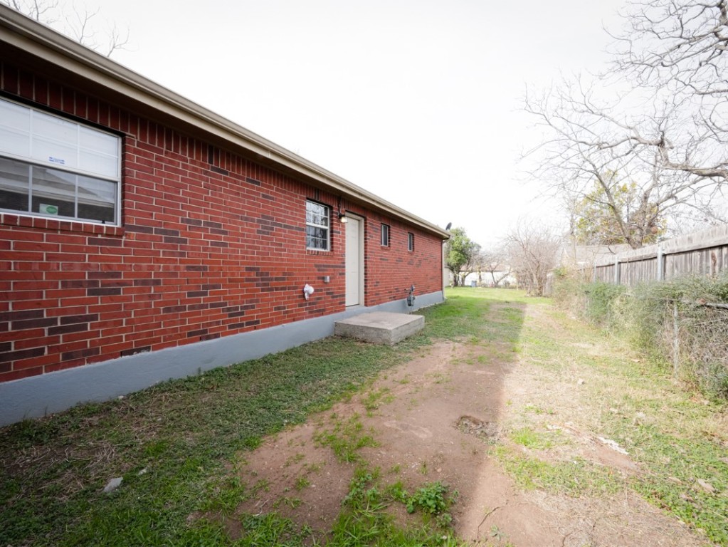 7312 Providence Avenue Austin, TX 78752 - Photo 17 of 22 a front view of a house with a yard