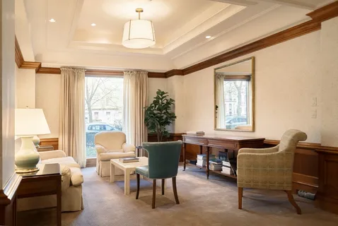 a view of a livingroom with furniture and a window