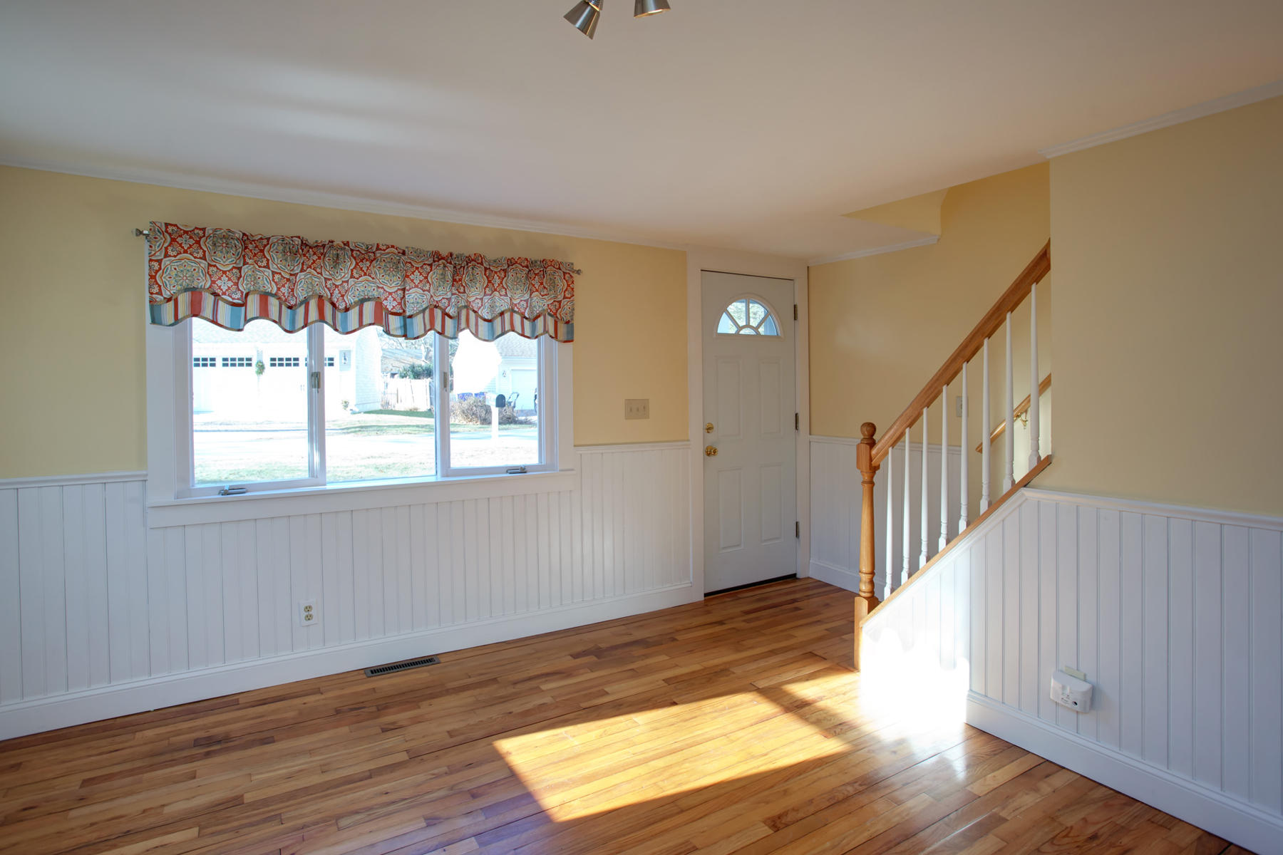 46 Thorne Road Bourne, MA 02532 - Photo 13 of 32 a view of an empty room with wooden floor and a window
