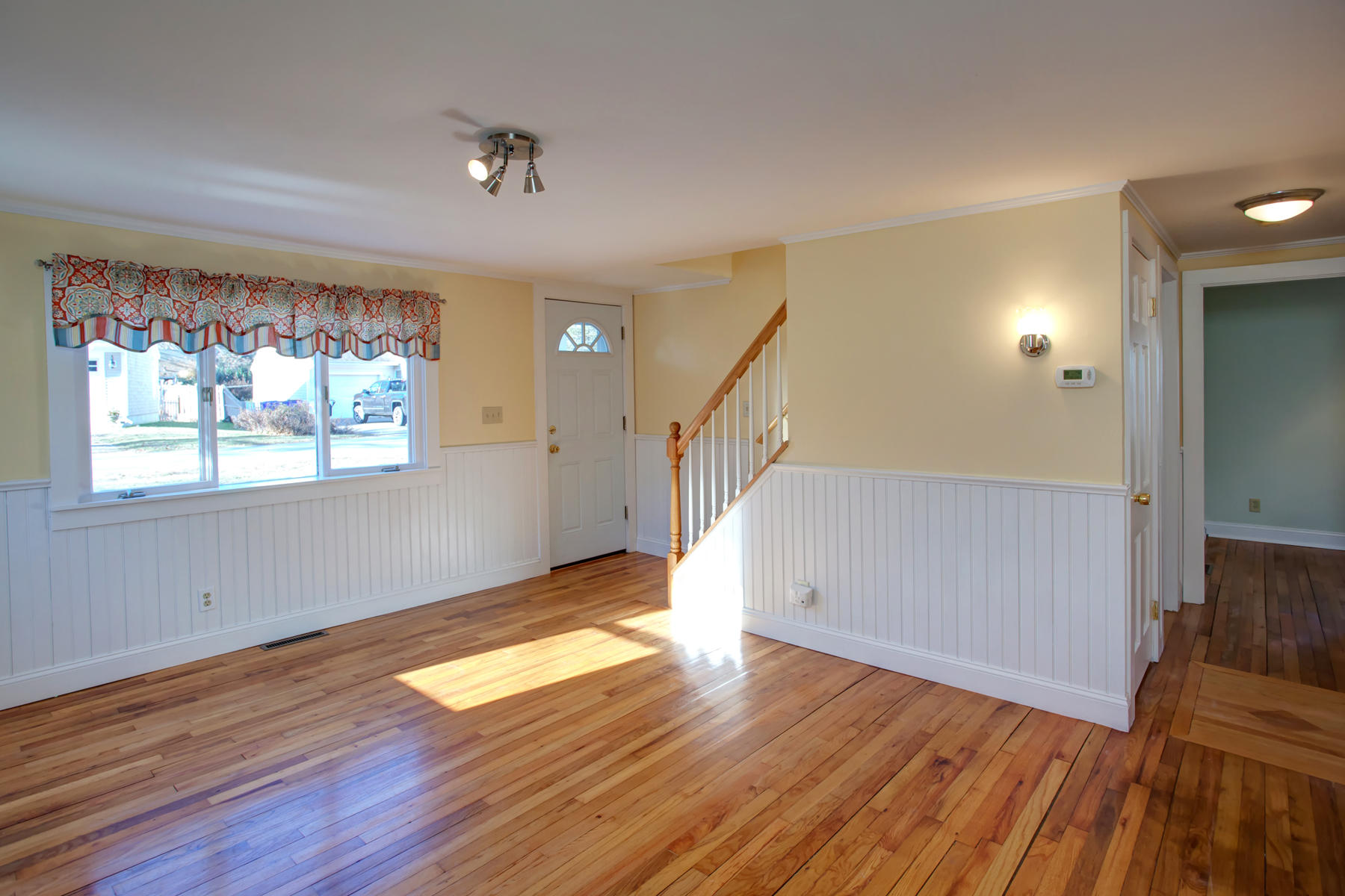 46 Thorne Road Bourne, MA 02532 - Photo 14 of 32 a view of an empty room with wooden floor and a window