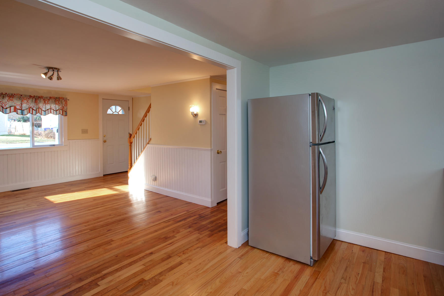 46 Thorne Road Bourne, MA 02532 - Photo 19 of 32 a view of a kitchen with wooden floor and a refrigerator