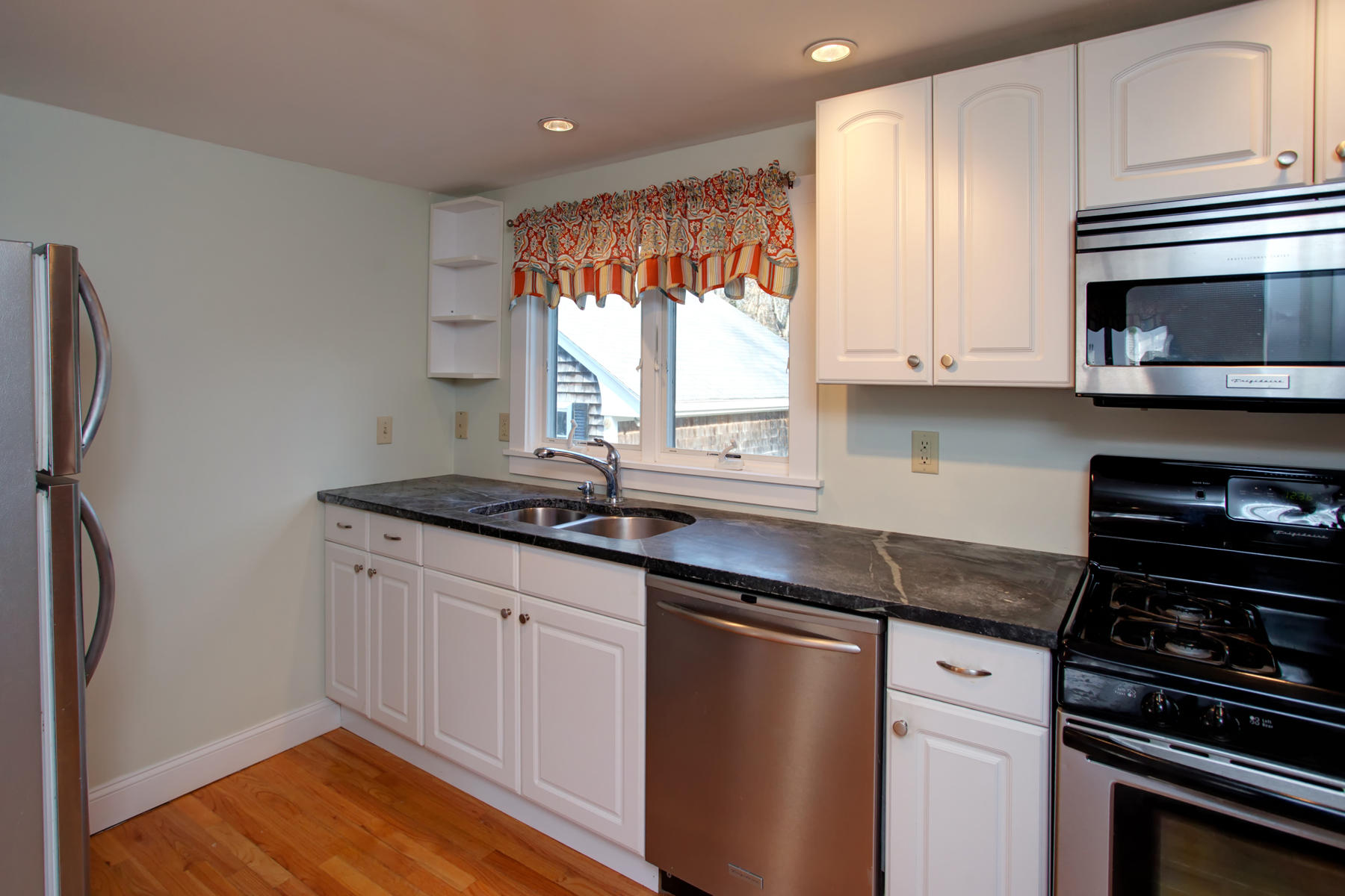 46 Thorne Road Bourne, MA 02532 - Photo 20 of 32 a kitchen with stainless steel appliances granite countertop a sink stove and refrigerator