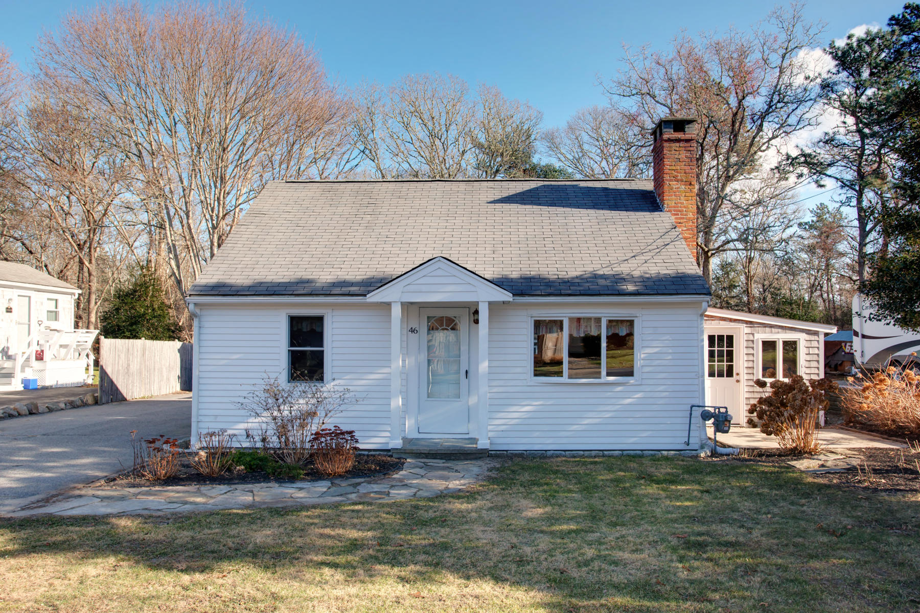 46 Thorne Road Bourne, MA 02532 - Photo 2 of 32 a front view of a house with a yard