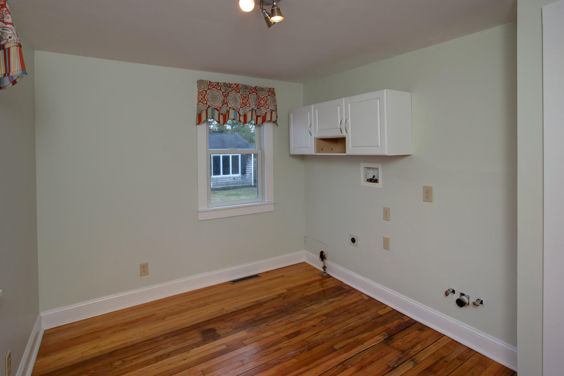 46 Thorne Road Bourne, MA 02532 - Photo 24 of 32 a view of kitchen with wooden floor and window