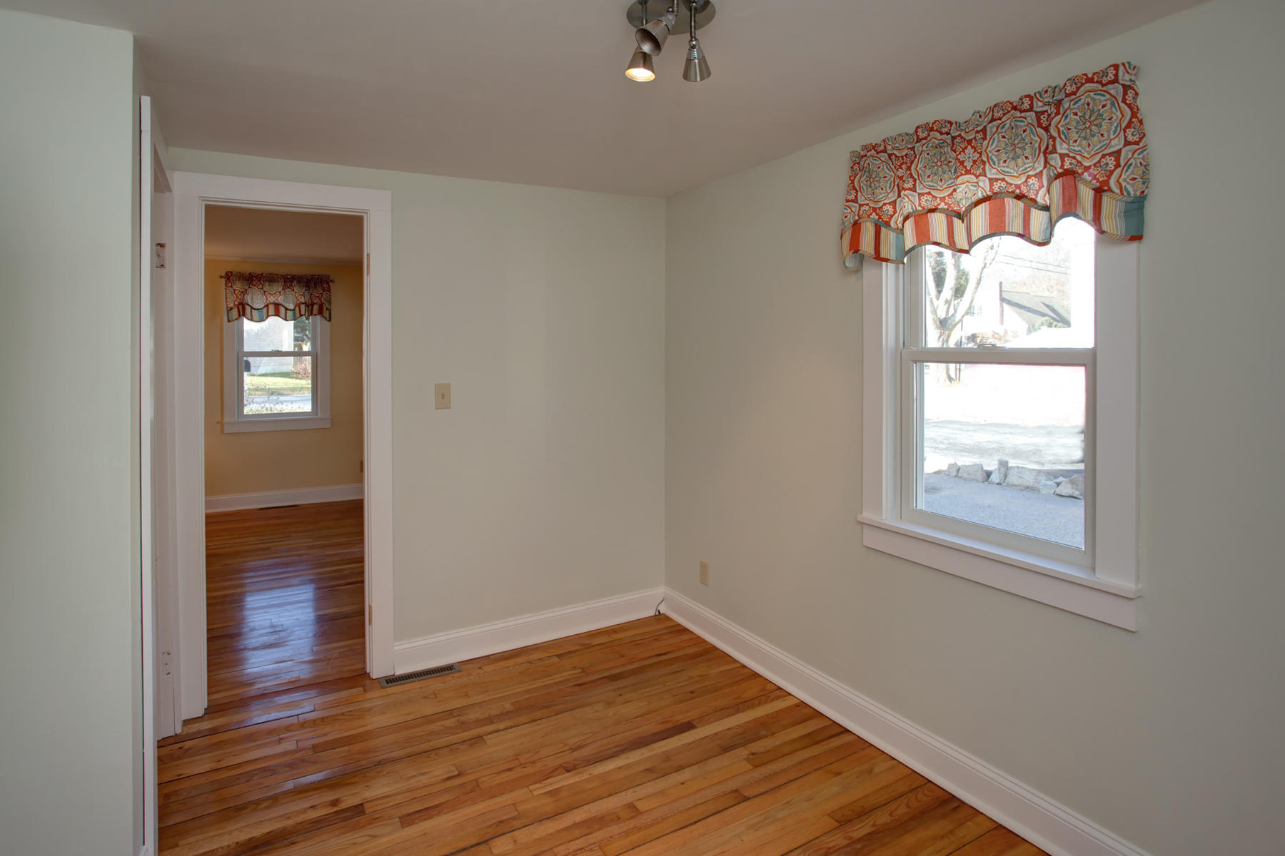 46 Thorne Road Bourne, MA 02532 - Photo 26 of 32 wooden floor in an empty room with a window