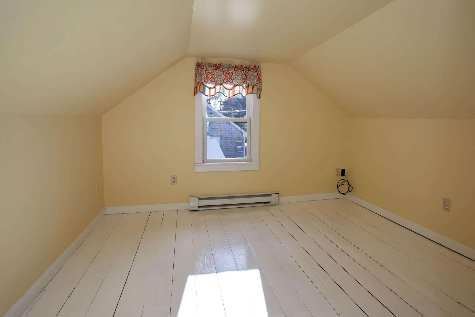 46 Thorne Road Bourne, MA 02532 - Photo 32 of 32 an empty room with wooden floor and windows