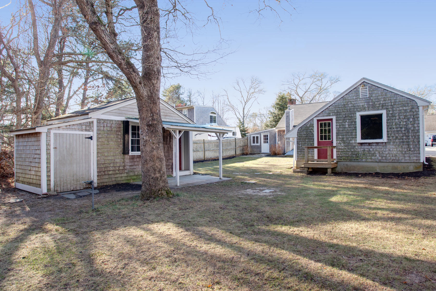 46 Thorne Road Bourne, MA 02532 - Photo 7 of 32 a view of a house with a yard covered in snow