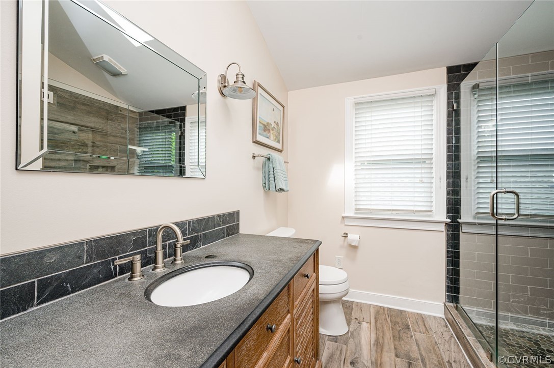 2114 Hawk Town Road Maidens, VA 23102 - Photo 28 of 50 a bathroom with a granite countertop sink toilet and mirror