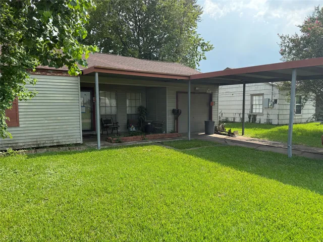 a view of a house with a garden and porch