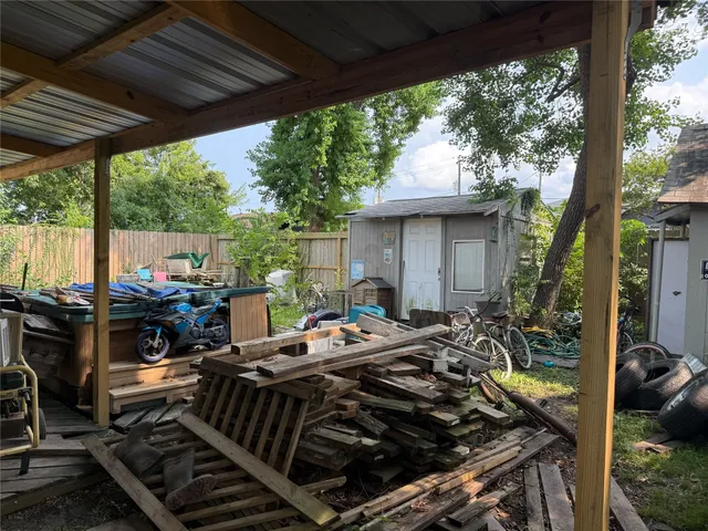 a outdoor living space with patio furniture and a fireplace