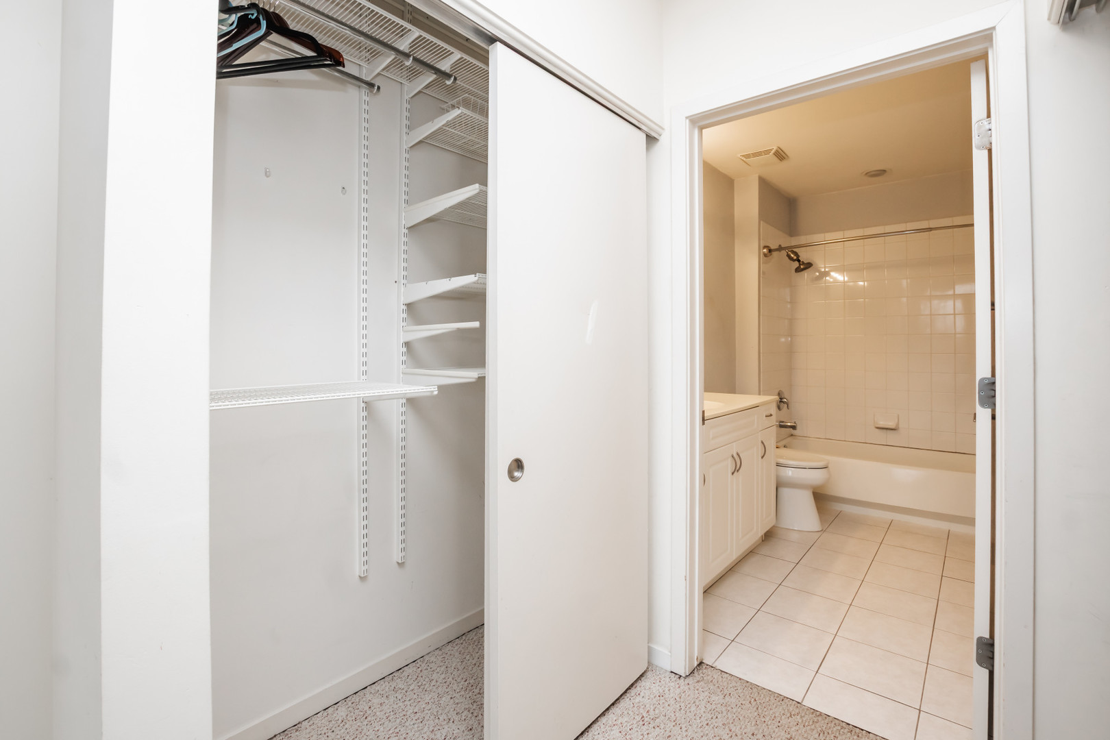 7243 Madison Street, Unit 310 Forest Park, IL 60130 - Photo 11 of 23 a bathroom with a glass shower door