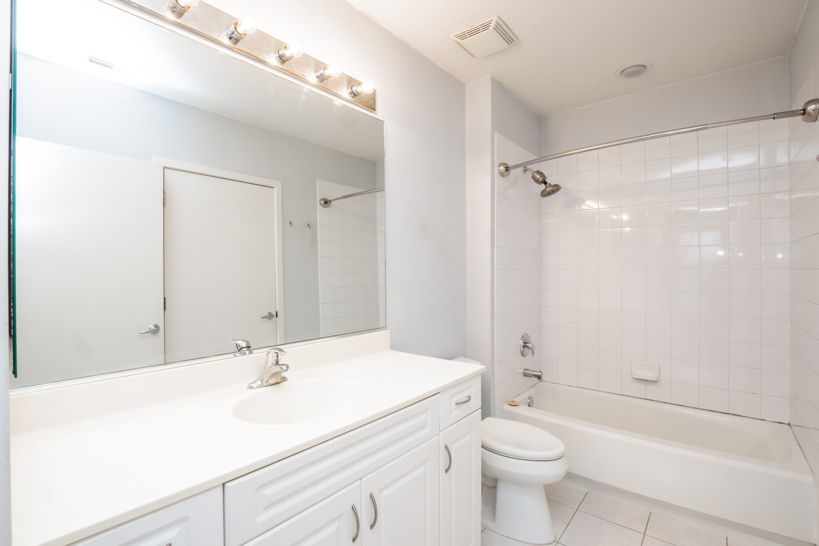 7243 Madison Street, Unit 310 Forest Park, IL 60130 - Photo 12 of 23 a bathroom with a sink a toilet and shower