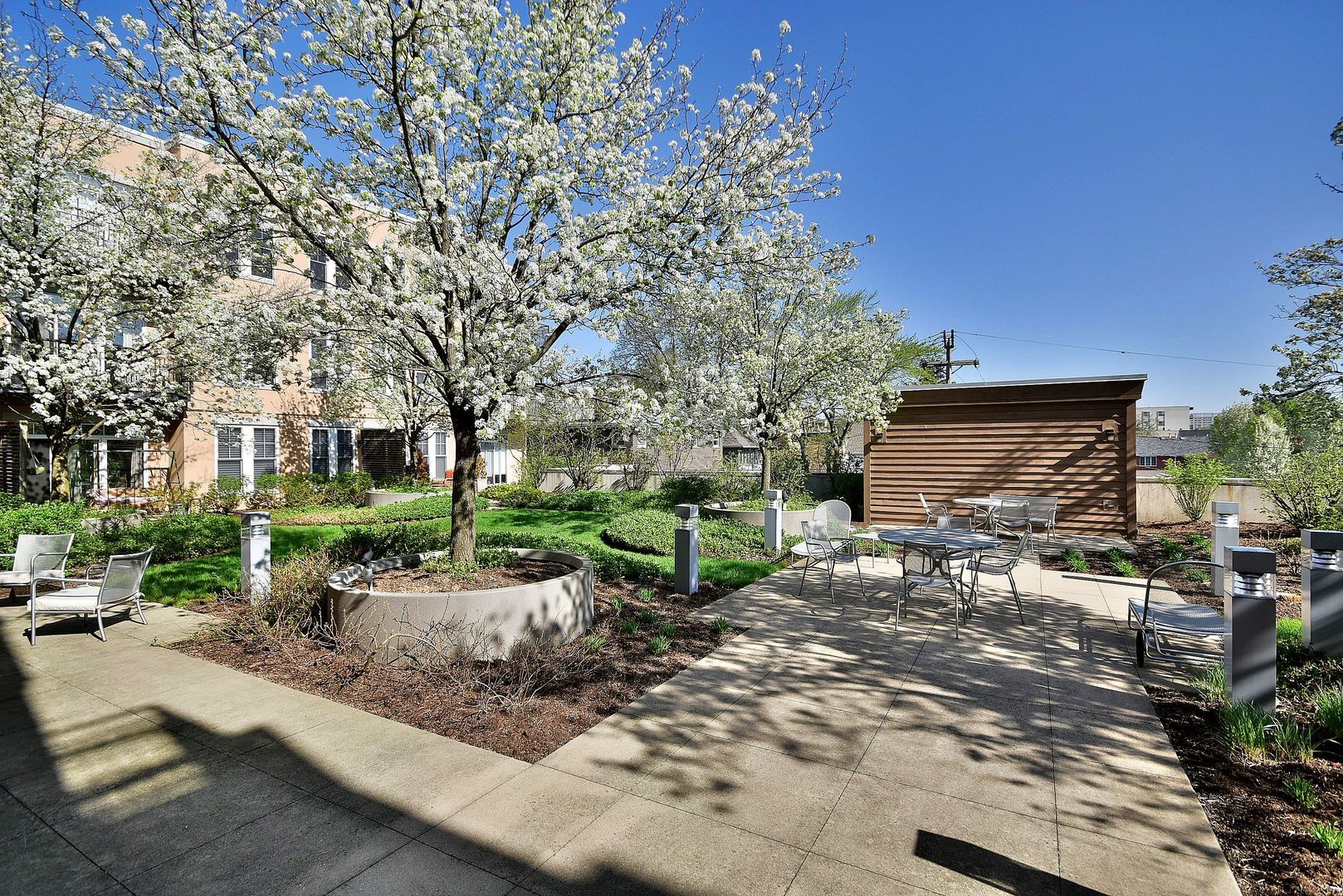 7243 Madison Street, Unit 310 Forest Park, IL 60130 - Photo 15 of 23 a view of a patio with table and chairs under an umbrella