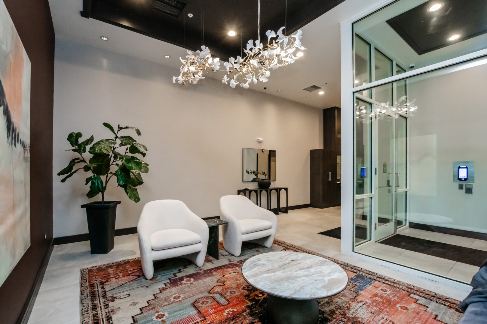 7243 Madison Street, Unit 310 Forest Park, IL 60130 - Photo 17 of 23 a living room with furniture and a chandelier