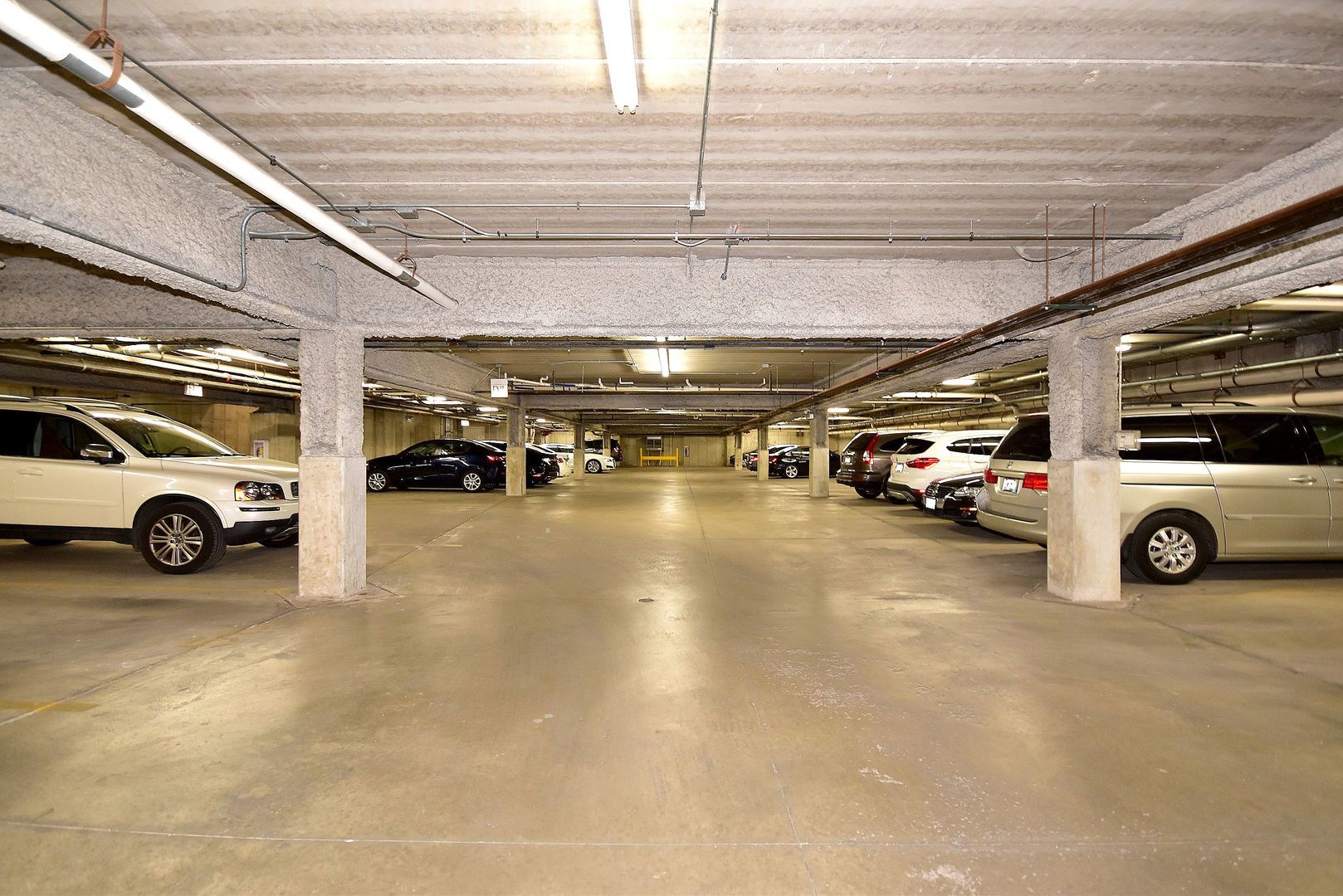 7243 Madison Street, Unit 310 Forest Park, IL 60130 - Photo 22 of 23 a view of parking garage with cars parked