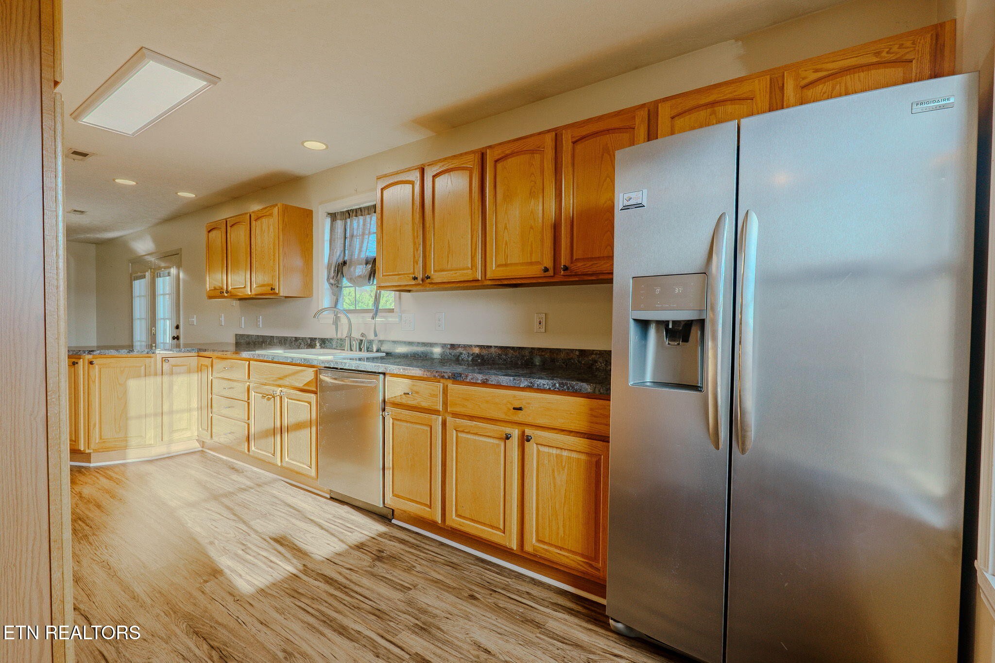 6622 Carina Lane Corryton, TN 37721 - Photo 11 of 30 a kitchen with stainless steel appliances granite countertop a refrigerator and a sink