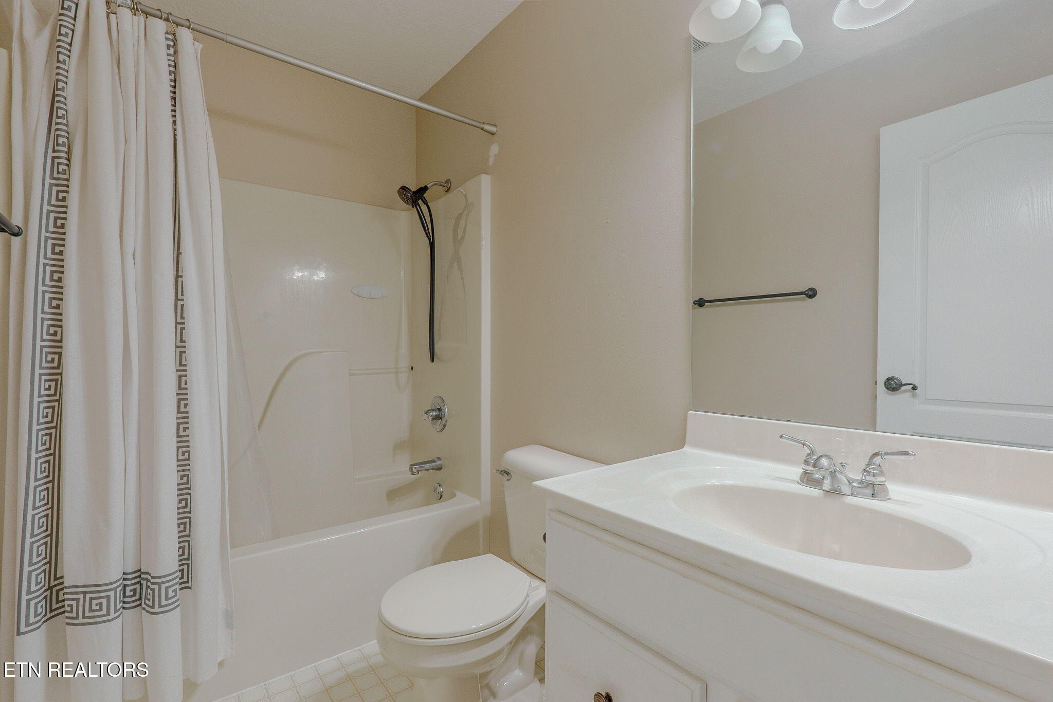 6622 Carina Lane Corryton, TN 37721 - Photo 19 of 30 a bathroom with a sink toilet and shower