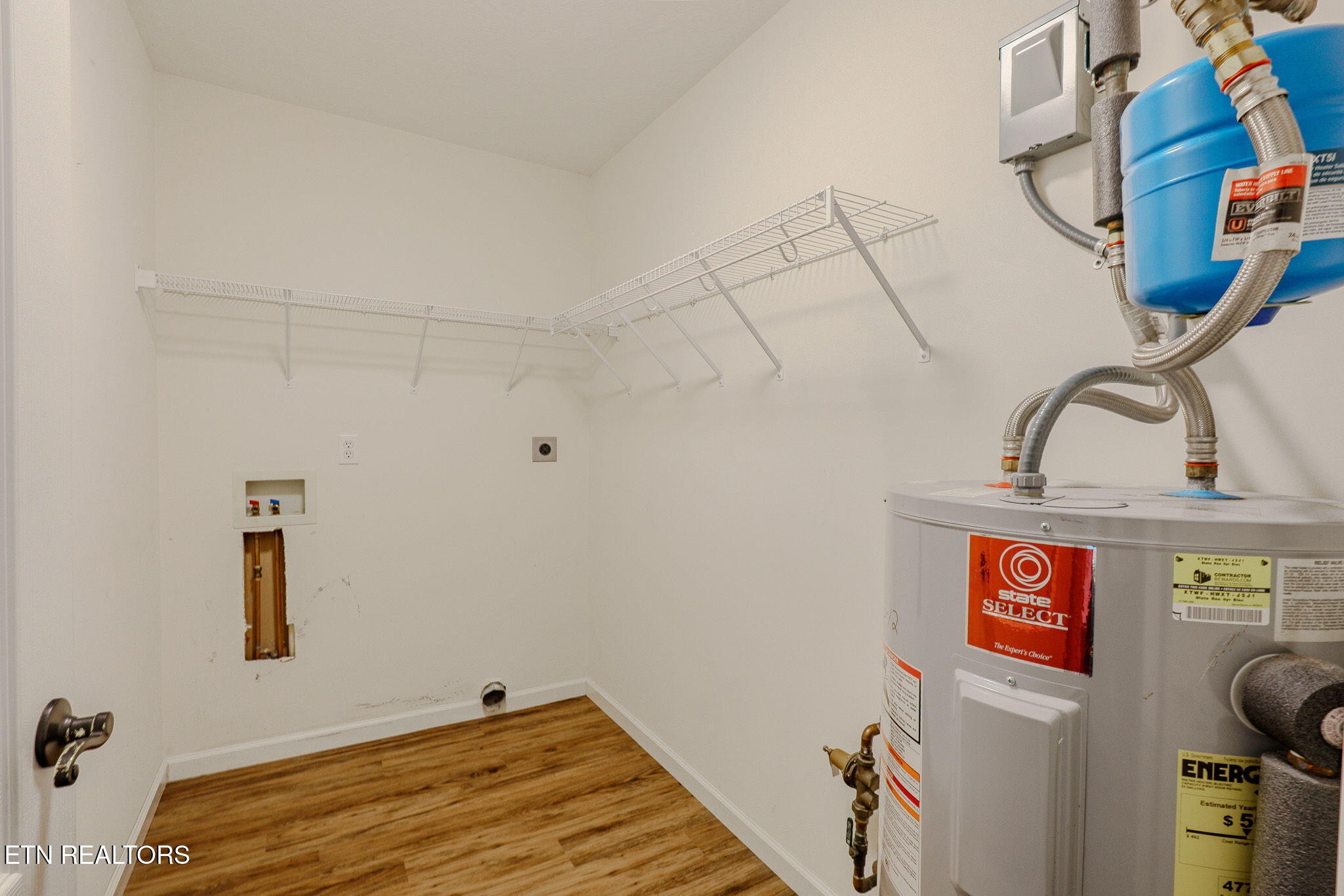 6622 Carina Lane Corryton, TN 37721 - Photo 27 of 30 a view of storage and utility room with racks on the wall