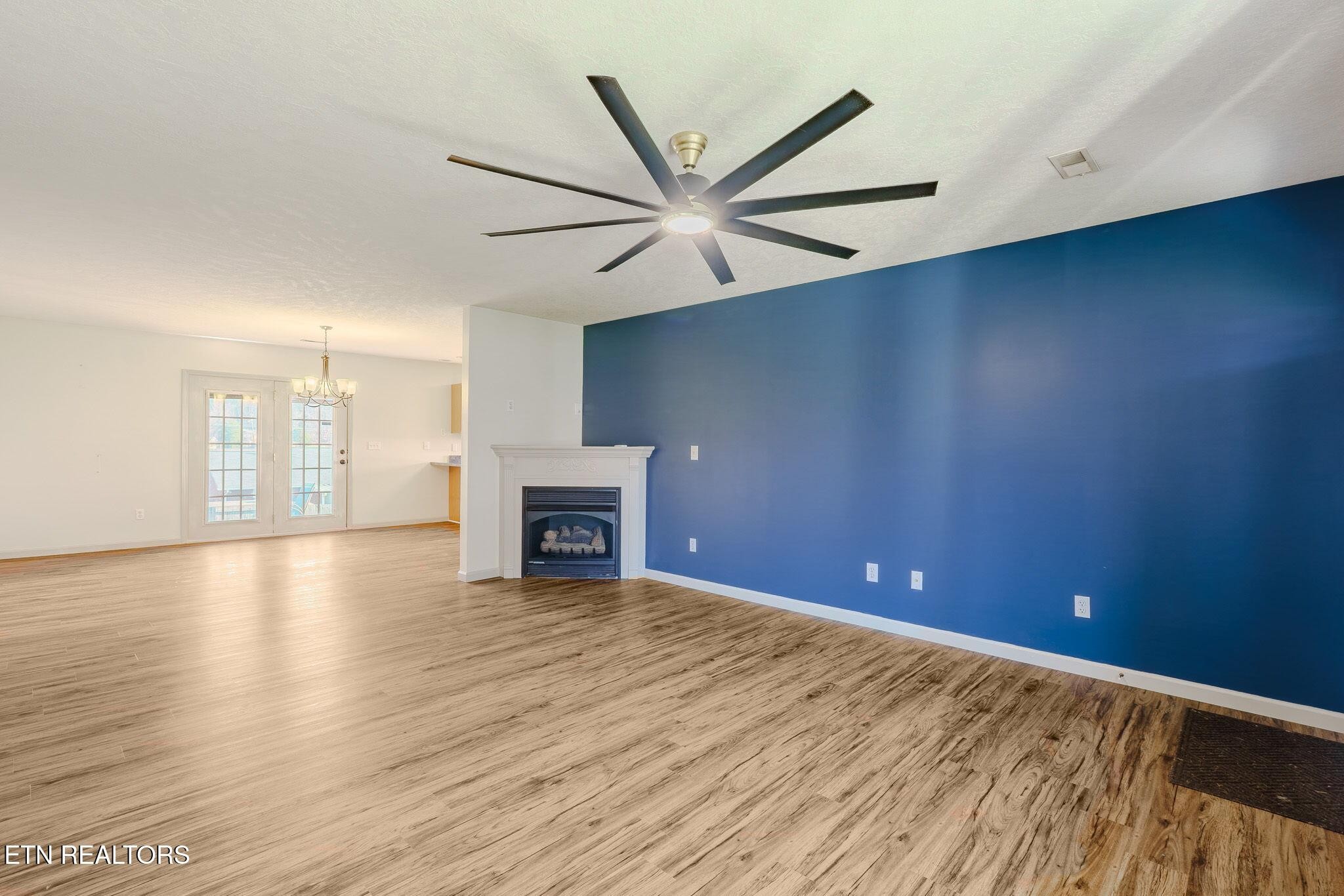 6622 Carina Lane Corryton, TN 37721 - Photo 7 of 30 wooden floor in an empty room with a window