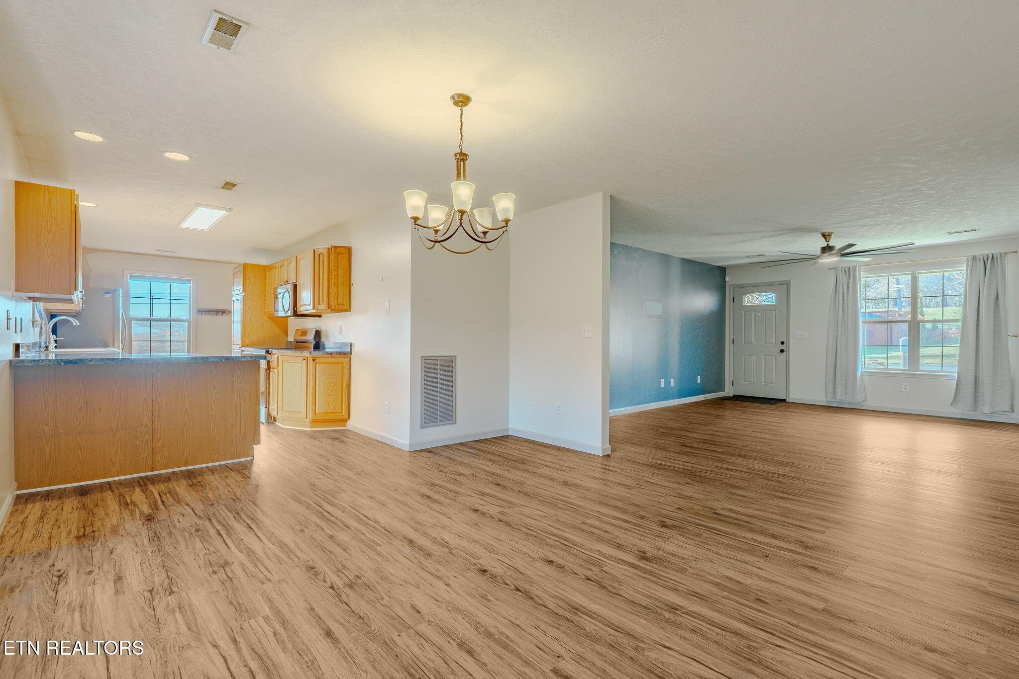 6622 Carina Lane Corryton, TN 37721 - Photo 10 of 30 a view of a livingroom with wooden floor