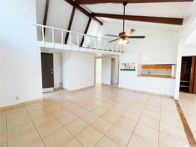 a view of a room with a sink and cabinets
