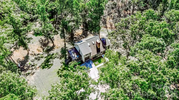 an aerial view of a house with outdoor space and street view