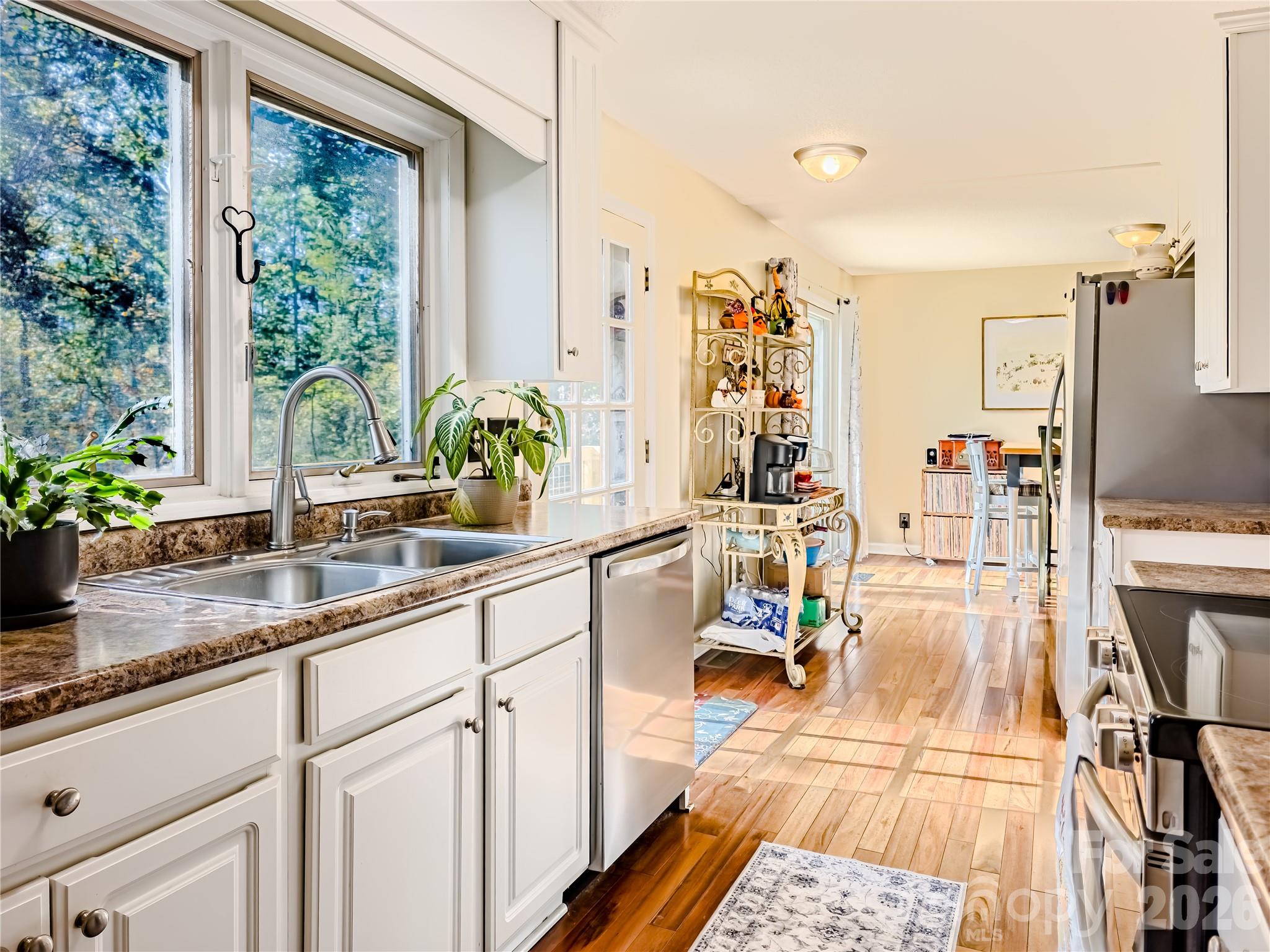 142 Padgett And Burns Road Forest City, NC 28043 - Photo 20 of 48 a very nice looking living room with a large window and wooden floor