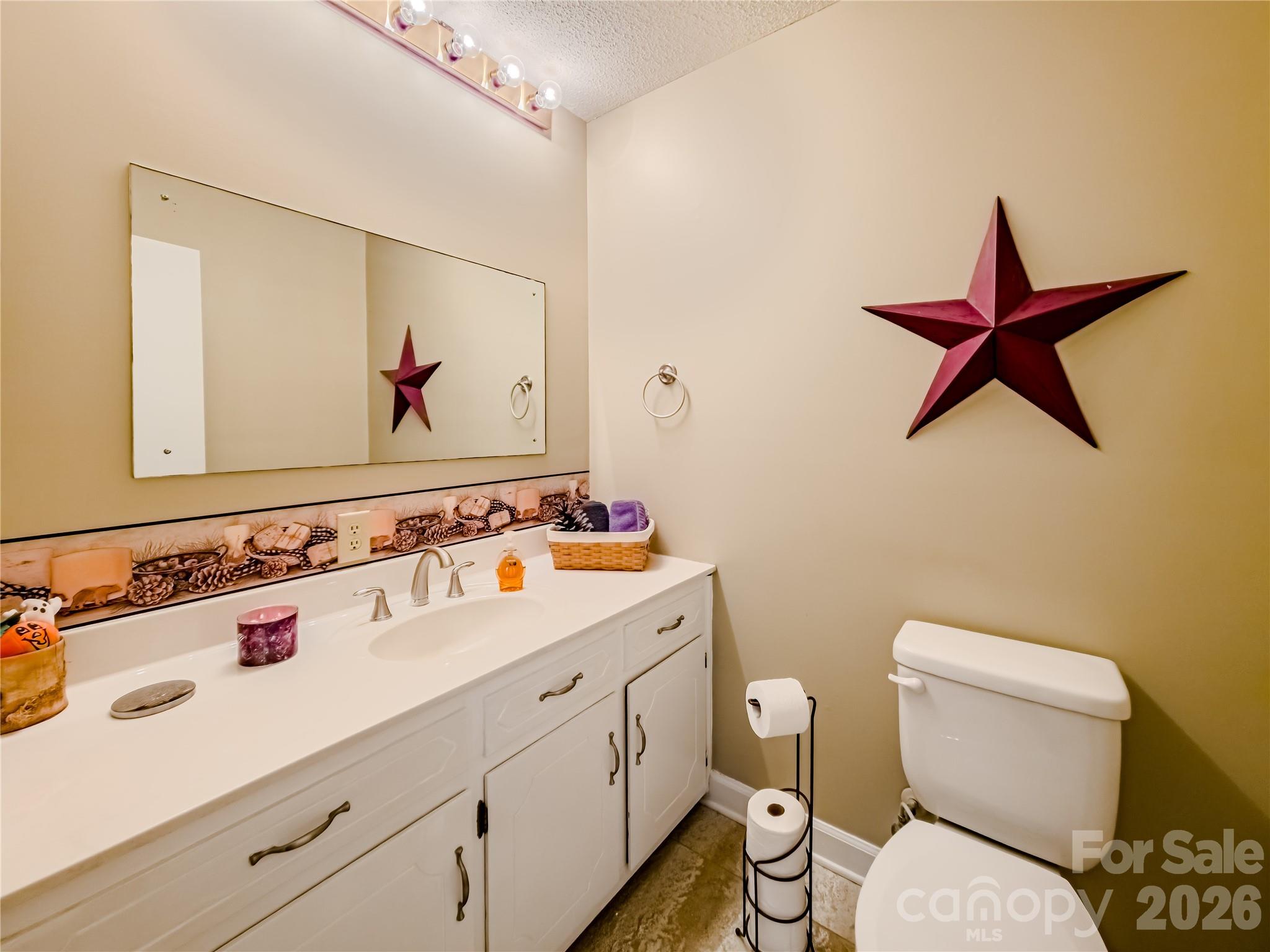 142 Padgett And Burns Road Forest City, NC 28043 - Photo 22 of 48 a bathroom with a toilet sink and mirror