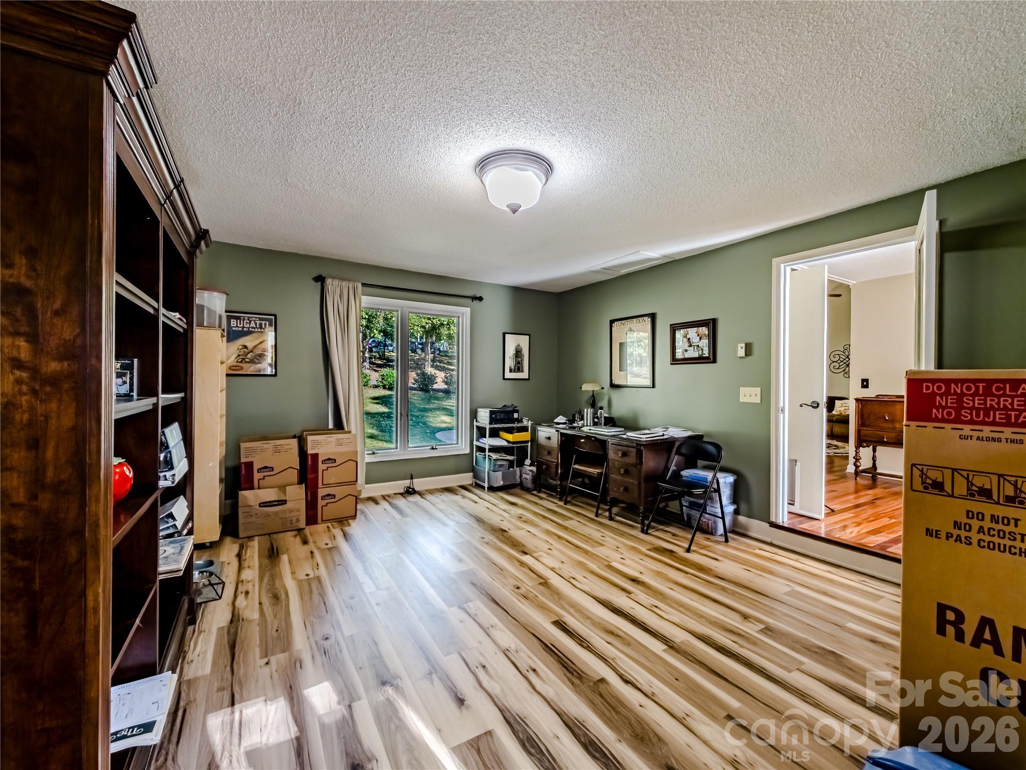142 Padgett And Burns Road Forest City, NC 28043 - Photo 23 of 48 a living room with furniture and a wooden floor