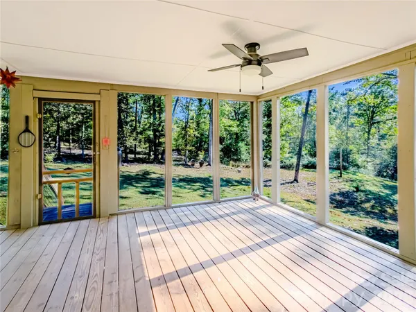 a view of a house with wooden floor and outdoor space