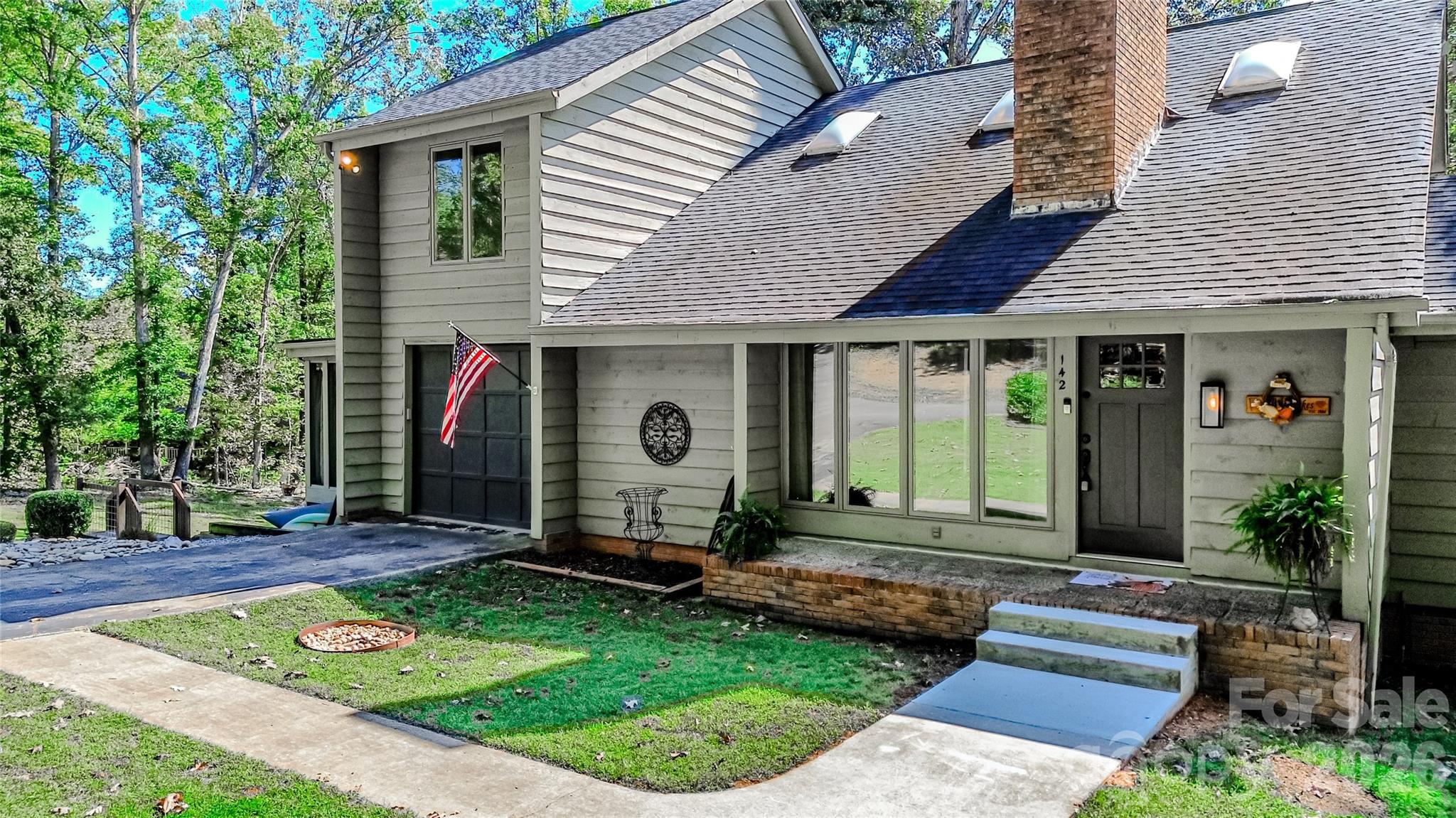 142 Padgett And Burns Road Forest City, NC 28043 - Photo 3 of 48 a front view of a house with garden