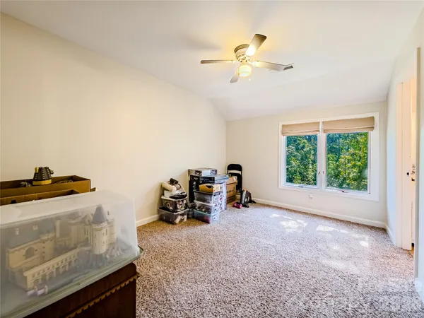 a view of workspace with furniture and window