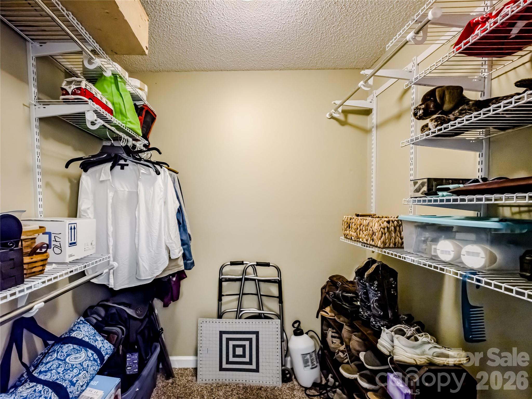 142 Padgett And Burns Road Forest City, NC 28043 - Photo 35 of 48 a view of walk in closet with clothes and shoes