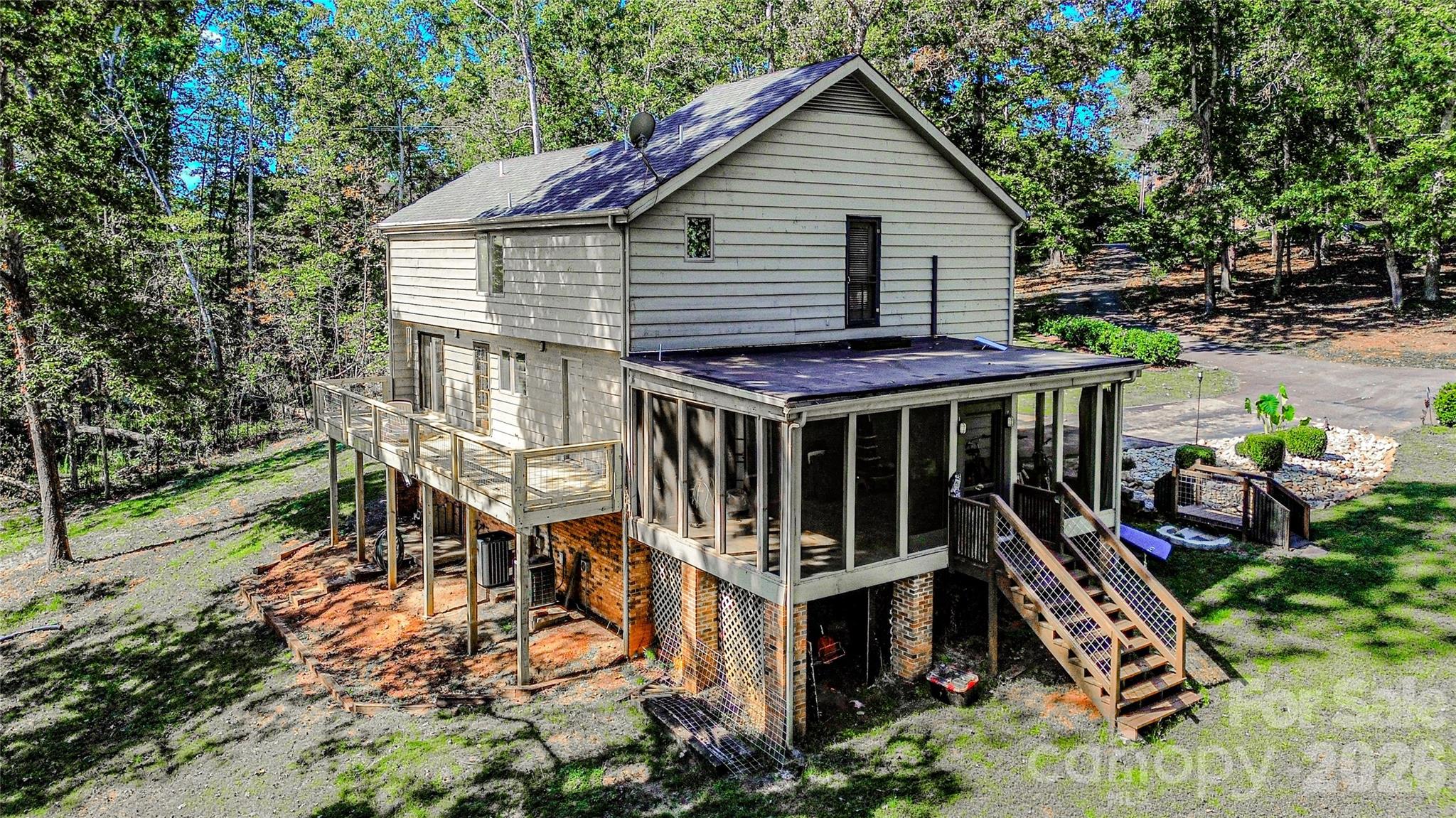 142 Padgett And Burns Road Forest City, NC 28043 - Photo 5 of 48 a view of a house with wooden deck front of house