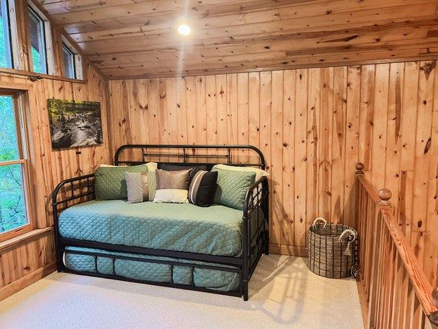 893 Hooper Road Cleveland, GA 30528 - Photo 25 of 68 a bedroom with a bed and wooden floor