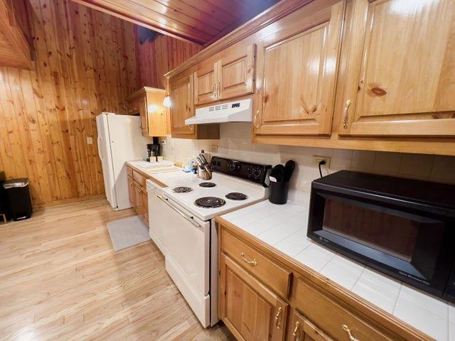 893 Hooper Road Cleveland, GA 30528 - Photo 34 of 68 a kitchen with a stove and a white wooden cabinets