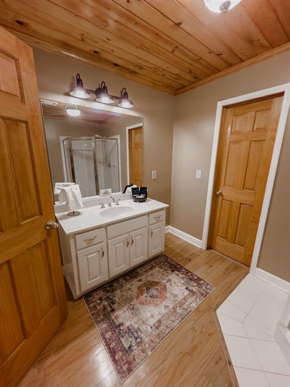893 Hooper Road Cleveland, GA 30528 - Photo 39 of 68 a bathroom with a double vanity sink and a mirror