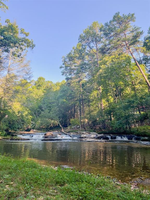 893 Hooper Road Cleveland, GA 30528 - Photo 48 of 68 a view of a lake with houses with outdoor space