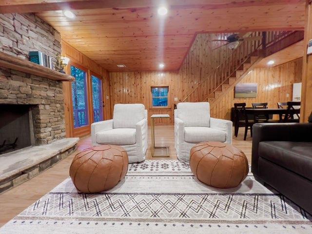 893 Hooper Road Cleveland, GA 30528 - Photo 10 of 68 a living room with furniture a fireplace and a chandelier