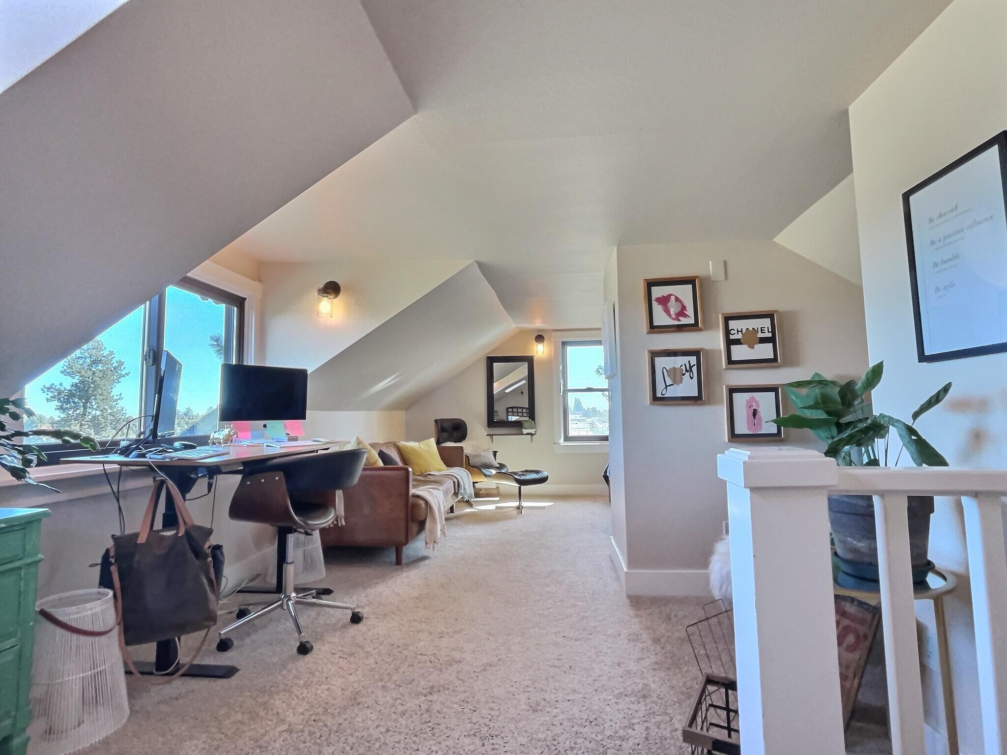 60360 Horse Butte Road Bend, OR 97702 - Photo 27 of 58 a living room with furniture and a flat screen tv