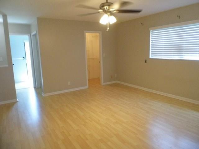 610 Southwest 17th Street Boca Raton, FL 33486 - Photo 11 of 49 a view of an empty room with wooden floor and a window