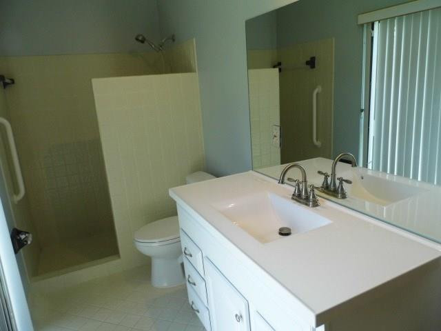 610 Southwest 17th Street Boca Raton, FL 33486 - Photo 12 of 49 a bathroom with a sink a toilet and shower